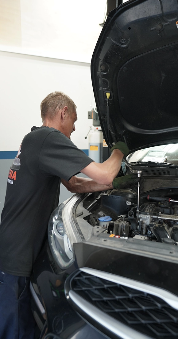 Mechanic Conducting Car Inspection at Auto Repair and Smog Near Me