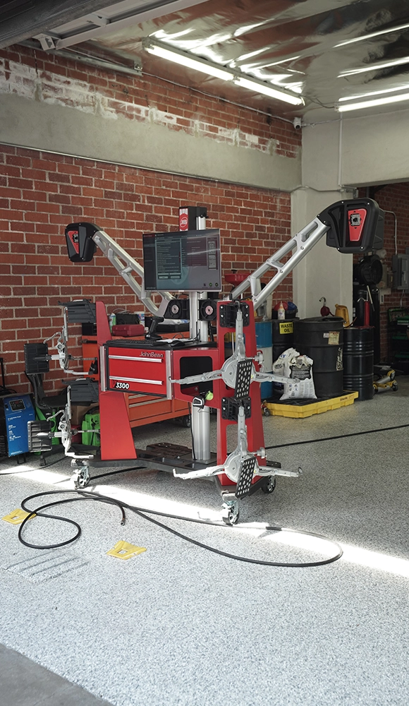 Auto Diagnostic Repair Machine in Garage with Brick Wall Background