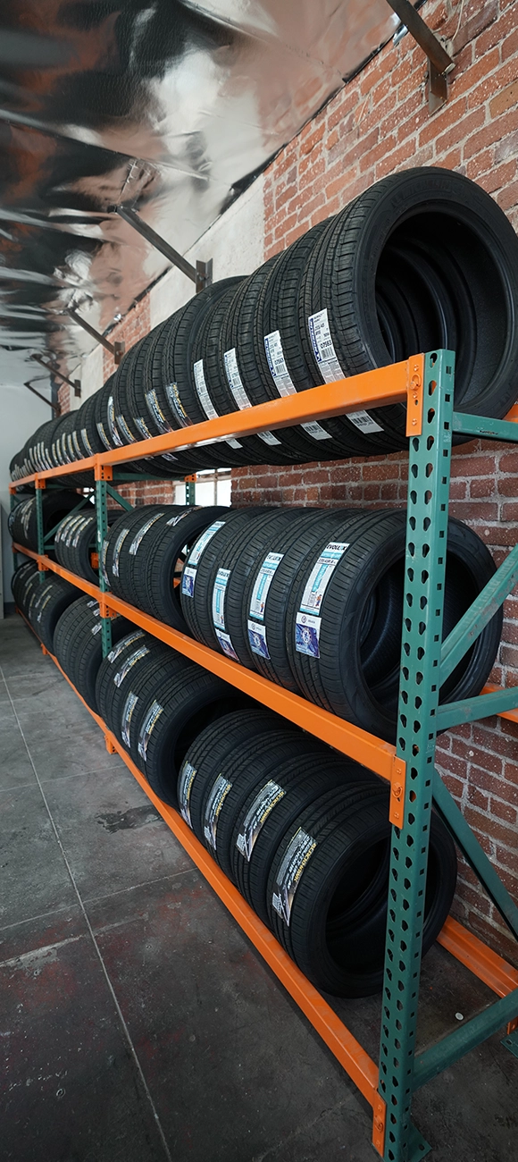 Tires Stacked on Shelves in Auto Repair Shop Near Me